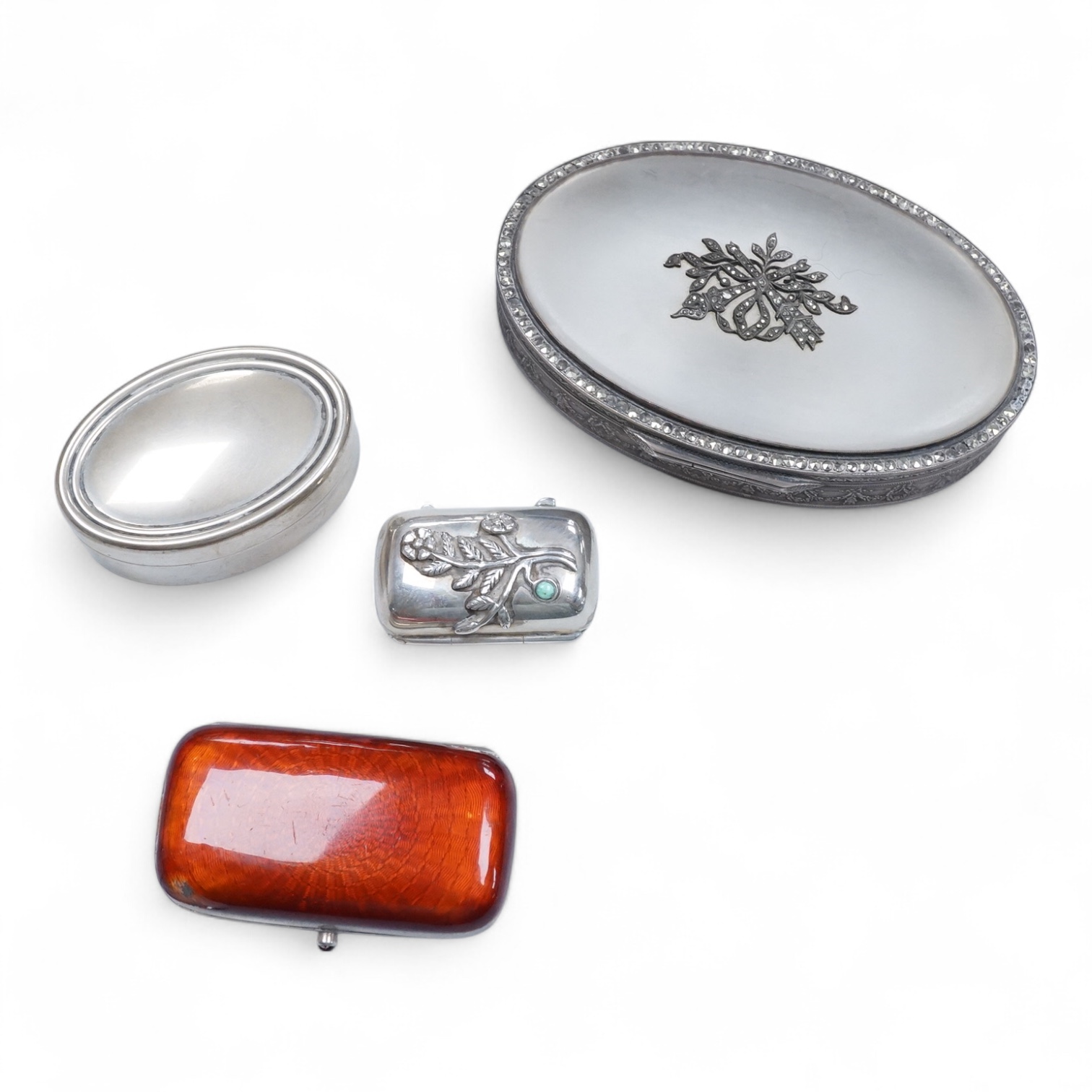 A continental 935 standard white metal oval box, with inset frosted glass and marcasite set hinged cover, 82mm, together with three assorted small pill boxes, including enamelled(a.f.), an Italian 800 standard and a mode